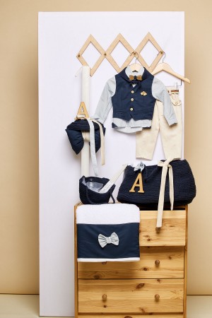 Τσάντα βάπτισης με μπλε κορδόνι με το μικρό τσαντάκι για τα λαδοσέτ και η λαμπάδα βάπτισης με μπλε κορδόνι